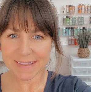 Julie infront of a lovely backdrop, shes the CEO of this store.